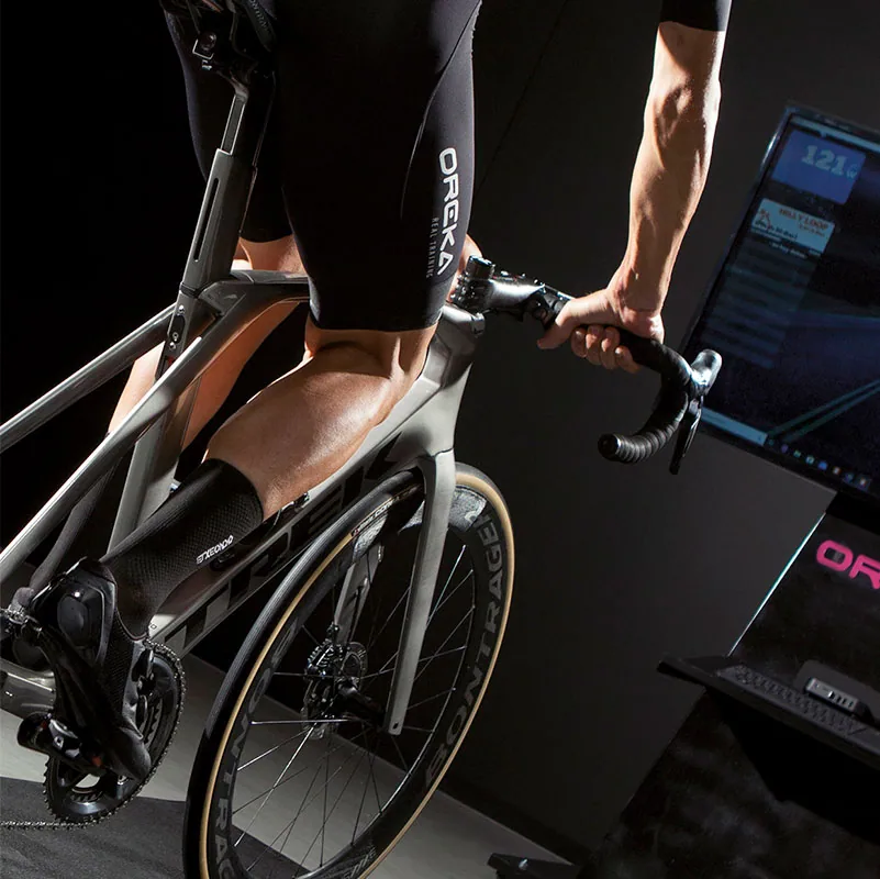 Cyclist riding an OREKA trainer, viewed from above